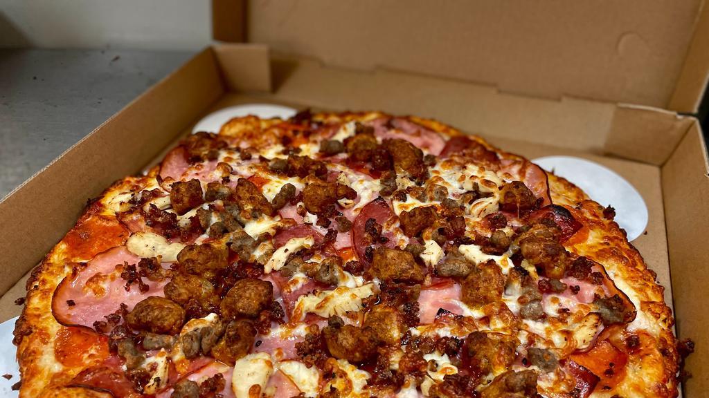 Meat Market · Pepperoni, Canadian bacon, salami, sausage, beef, bacon, chicken and extra cheese.