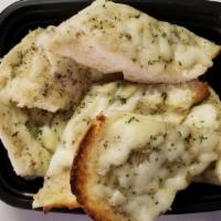 Side Of Garlic Bread With Cheese · Half loaf of isabella's italian baguette covered with a buttery garlic herb spread and mozza...