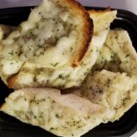 Side Of Garlic Bread · Our garlic and herb olive oil spread on a half of a loaf of isabella's italian baguette - to...