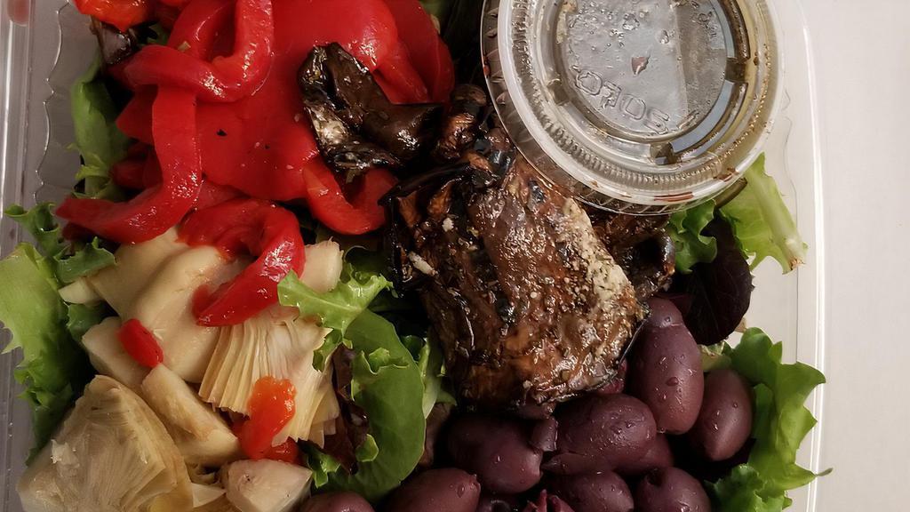 Mixed Green Salad · Spring mix lettuce, roasted peppers, grilled mushrooms, artichokes, kalamata olives with a balsamic dressing.