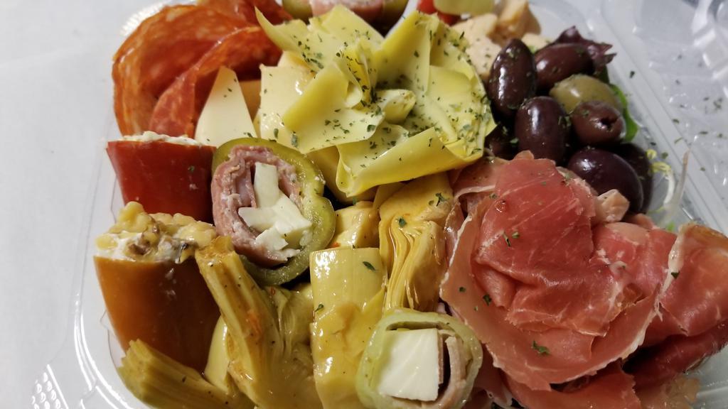 Antipasto Salad · A selection of our meats, cheeses and marinated veggies.