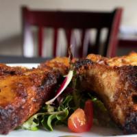 Tandoori Chicken Wings · Chicken wings marinated in tandoori spices and grilled in clay oven