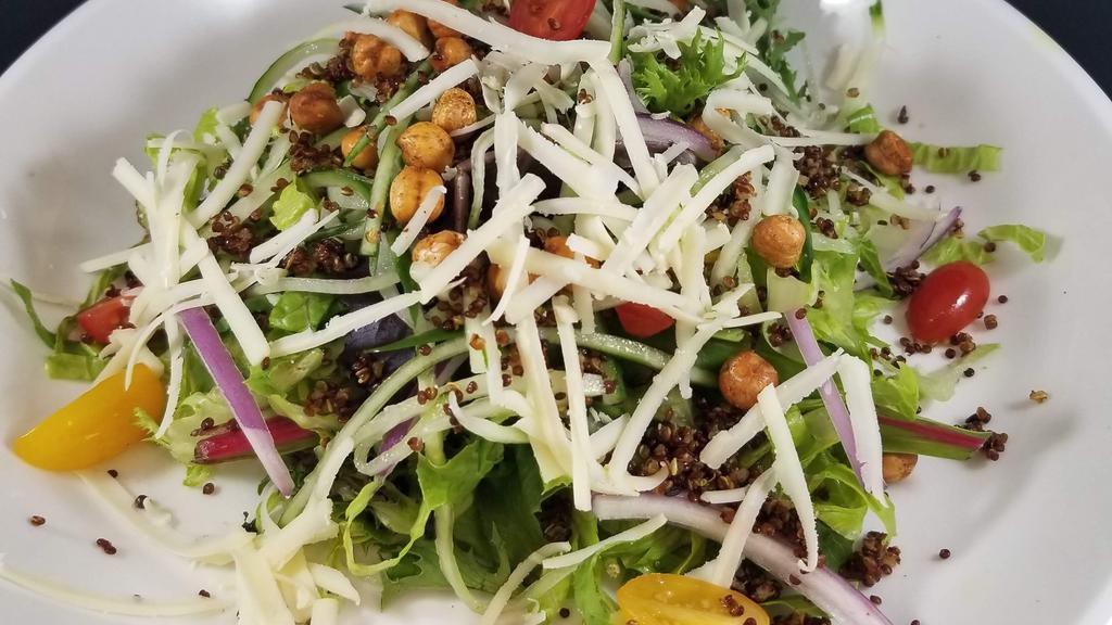 House Salad · Choice avocado or ginger pineapple dressing seasonal mixed green, grape tomato, English cucumber, red onion,  toasted chickpeas, quinoa,  Indian cheddar cheese.