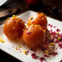 Gulab Jamun With Roasted Nuts · A light pastry dumpling made with fresh milk and sweet honey served warm.