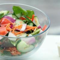 House Salad · Spring Mix, Shredded Carrots, Red Onions, Tomato, & Cucumber.