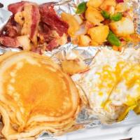Pancake Plater · Three pancakes or three French toast with turkey bacon or beef sausage and two eggs served w...
