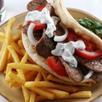 Halal Lamb Gyro · With French fries and can of soda.