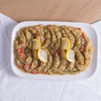Eggplant Salad · A lemony, lightly spicy, mashed grilled eggplant, roasted bell peppers, tomatoes, garlic, an...