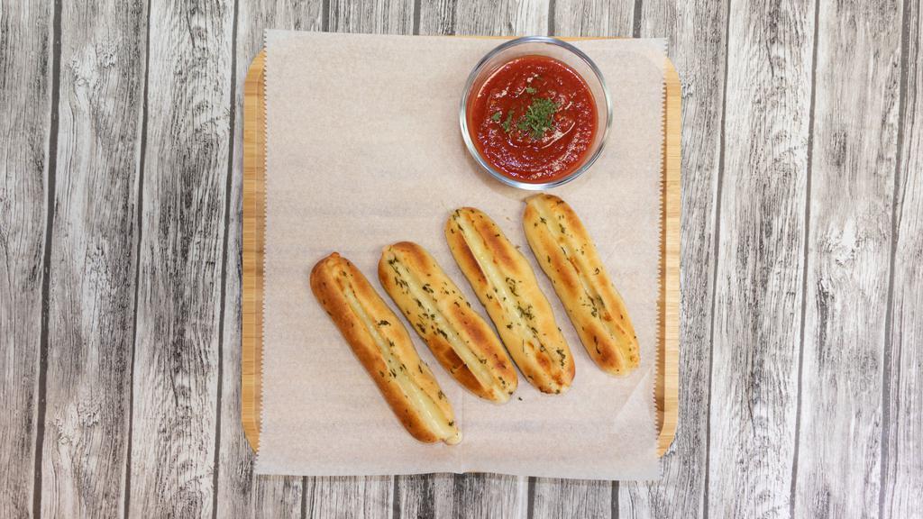 Cheese Breadsticks · Four pieces with marinara.