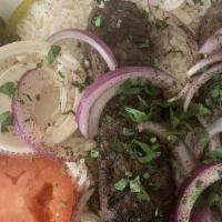 Kafta Kabob · Lean ground beef mixed with newly chopped onions, parsley and kafta spices. Served with tahi...