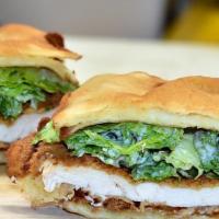 Naan Caesar Sandwich · Juicy Fried Chicken breast, crispy romaine lettuce tossed with creamy Caesar dressing served...