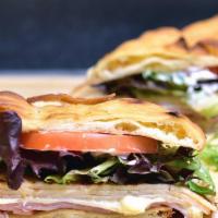 Naan Bistro Sandwich · Fried naan bread with mesclun lettuce, tomato, turkey, Swiss cheese, ham and mayo