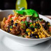 Carnitas Pueblo Bowl · Carnitas served with rice, avocado, corn and black beans salad, cilantro, pico de gallo, and...
