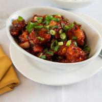 Gobi Manchurian · Dry cauliflower fritters with com flour cooked in spicy manchurian sauce.