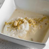 Rasmalai · Two pieces. Homemade cheese in special condensed milk flavored with rose water and garnished...