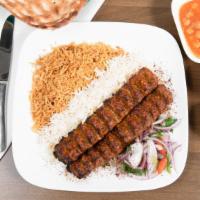 Beef Koobideh · Ground beef, mixed with chopped onions, seasoning, and char-grilled. Served with drink.