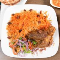 Qabuli Pulao · Lamb shank served with authentic brown rice, topped with sweet raisins, carrots, and drink.