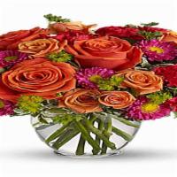 Sweet Orange · Beautiful orange roses, carnations and green filler designed in a vase