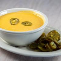 Chile Con Queso · Served with chips.