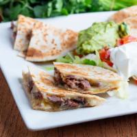 Quesadillas · Four Flour Tortillas stuffed with beef, chicken or grilled vegetables and Monterey Jack chee...