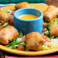 Changitos · 6 Flour tortilla pieces stuffed with Fajita and Monterrey cheese then fried. Served with Que...