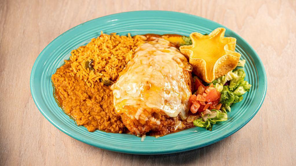Chile Relleno · One poblano pepper stuffed with beef or chicken, topped with
red sauce and Monterey Jack cheese. Served with rice, beans,
tortillas and a cheese puff.