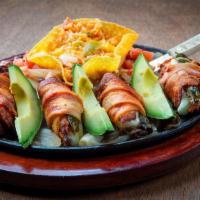 Chicken Diablos · Four strips of chicken stuffed with a mild slice of jalapeño and a slice of queso fresco, wr...