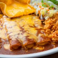Enchilada Dinner · Three ground beef, chicken, or cheese enchiladas. Served with
rice, beans & a cheese puff.