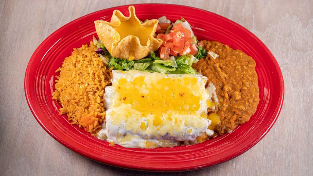 Sour Cream Enchiladas · Three shredded chicken enchiladas covered in a sour cream
sauce. Served with rice, beans & a cheese puff.
