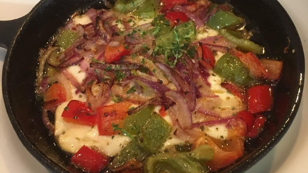Baked Greek Feta · Roasted feta cheese with green peppers, onions, tomatoes and EVOO.