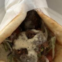 Falafel · Fresh made falafel served on pita bread, stuffed with lettuce, tomatoes, onions and tahini.