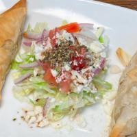 Spanakopita Dinner · Spinach, feta and herbs wrapped in phyllo pastry served with Greek potatoes and side Greek s...