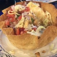 Taco Salad · Crispy flour tortilla shell filled with beef or chicken, beans. Lettuce, pico de gallo, chee...