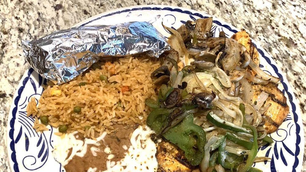 Pollo Feliz · Grilled chicken breast with mushrooms, onions, bell peppers and cheese dip. Served with rice, beans and tortillas.