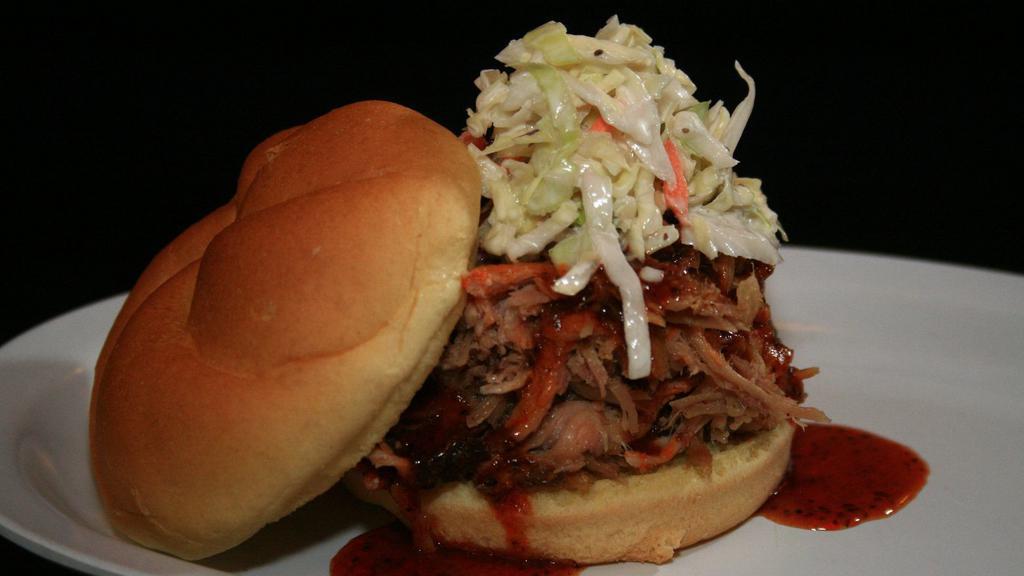 Pulled Pork Sandwich · Carolina BBQ sauce TOPPED WITH COLE SLAW.