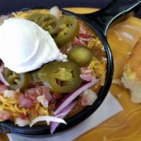 Loaded Chili Bowl · Cheddar cheese, jalapeños, raw onion, sour cream, bacon bits.