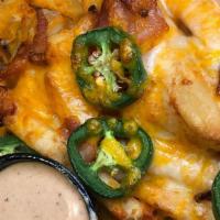 Caddy Fries · Fries covered in cheddar cheese, bacon, jalapenos & served w/ chipotle ranch