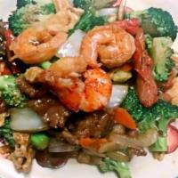 Happy Family · With rice. Jumbo shrimp, lobster meat, chicken and beef with black mushroom, snow peas, cele...