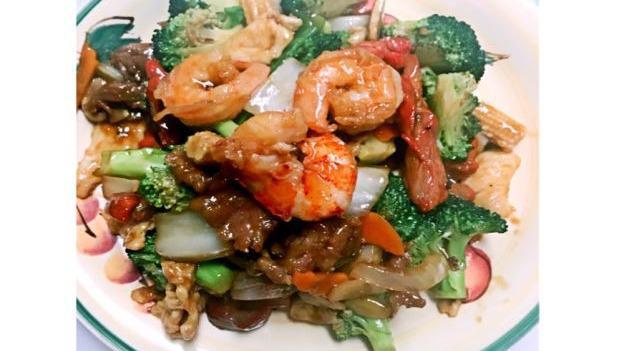Happy Family · With rice. Jumbo shrimp, lobster meat, chicken and beef with black mushroom, snow peas, celery and broccoli in chef's special sauce.