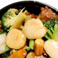 Beef With Scallop · With rice. Sliced of beef, scallop and fresh vegetable cooked in brown sauce.