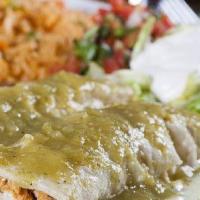 Chile Verde · Pork simmered in zesty Verde sauce and topped with melted cheese. Served with rice, lettuce,...
