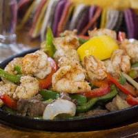 Fajitas · Grilled meat of your choice with red and green bell peppers and onions. Served with lettuce,...
