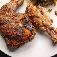 Jerk Chicken · Served with two sides.