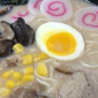 Tonkatsu Ramen · Japanese pork bone broth soup. Pork chashu, Japanese fish cake, green onions, corn, shiitake...