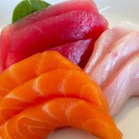 Sashimi Combo · 9 pieces sashimi, 4.5 oz (tuna, yellowtail, salmon).