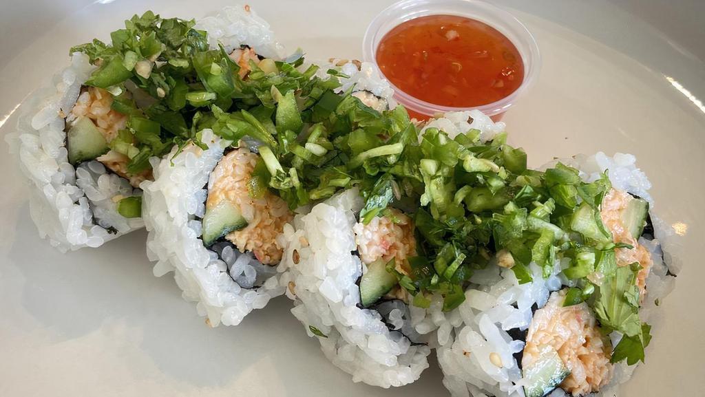 Stingray Roll · Spicy crab roll, topped cilantro/jalapeño mix, sweet chili sauce.