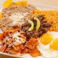 Chilaquiles · Fried tortillas topped with red salsa and cheese. Served with steak, rice and beans.