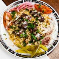 Lamb Kabab Plate · Includes rice, Pickles griled tomato, tahini sauce and green salad  (tomato, cucumber, lettu...