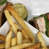 Turkey Club · Turkey breast with lettuce, tomato,
bacon, and mayo on your choice of
white, wheat, or rye t...