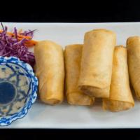 Spring Rolls · Mixed vegetable and glass noodle wrapped in spring rolls wrapper and deep fried. Served with...